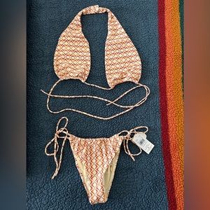 RVCA womens swimsuit. Large top. Small bottoms. New. Never worn. Tags attached.